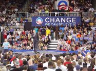 Barack Obama speaking on stage at his presidential campaign rally in Minges Coliseum
